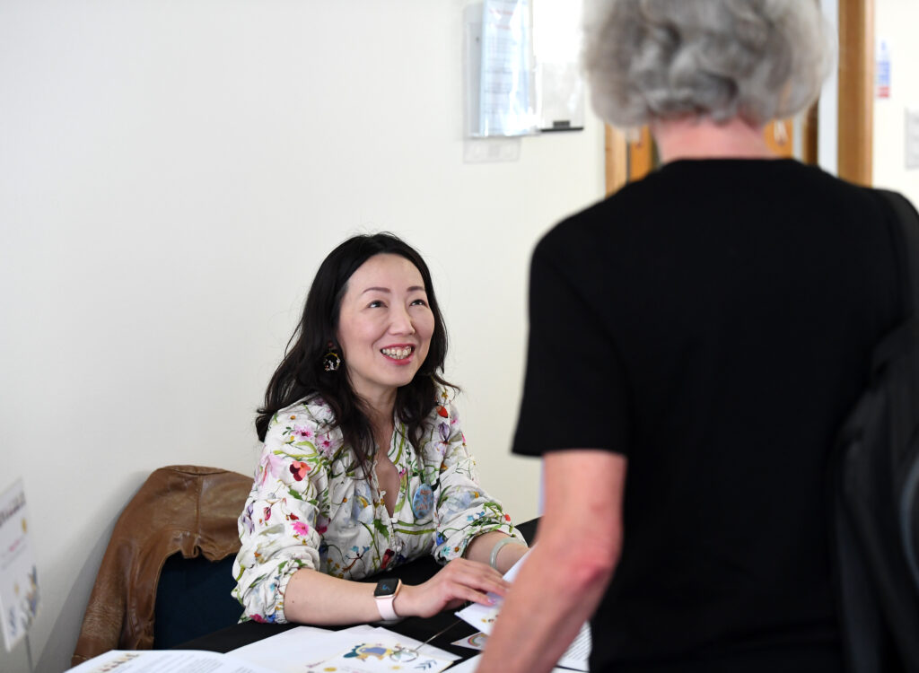 Smiling face while taking part in Happy to Chat